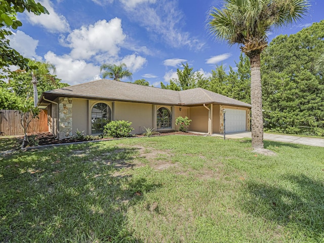 single story home with a garage and a front yard