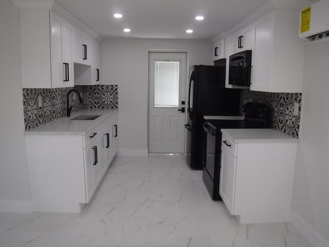 kitchen with white cabinetry, sink, backsplash, and black appliances