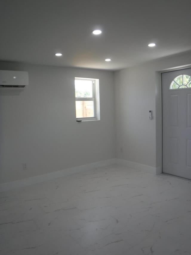 basement featuring a wall mounted AC