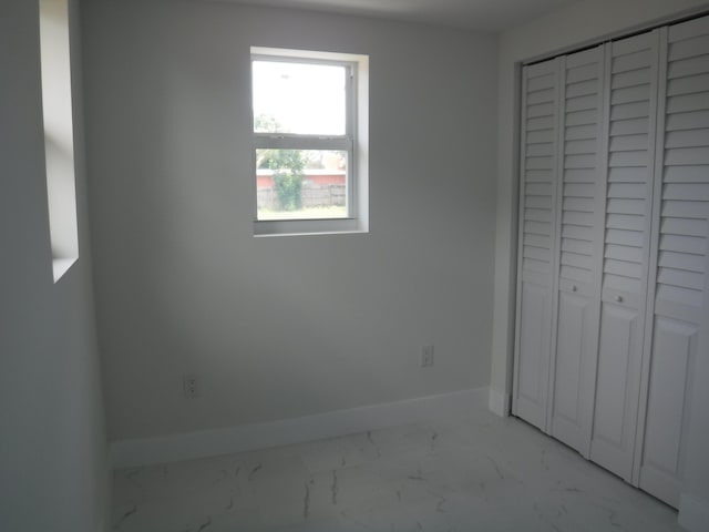 unfurnished bedroom with a closet