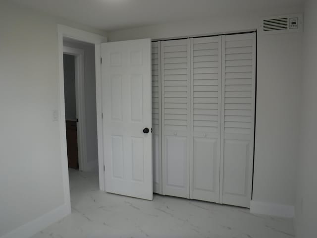 unfurnished bedroom featuring a closet