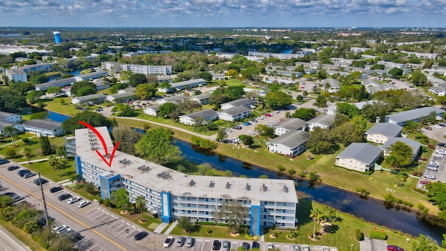 birds eye view of property featuring a water view