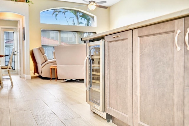 entrance foyer with wine cooler and ceiling fan