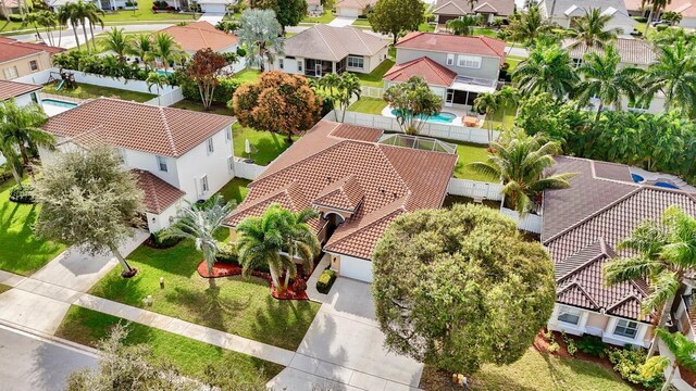 mediterranean / spanish-style home with a garage and a front yard