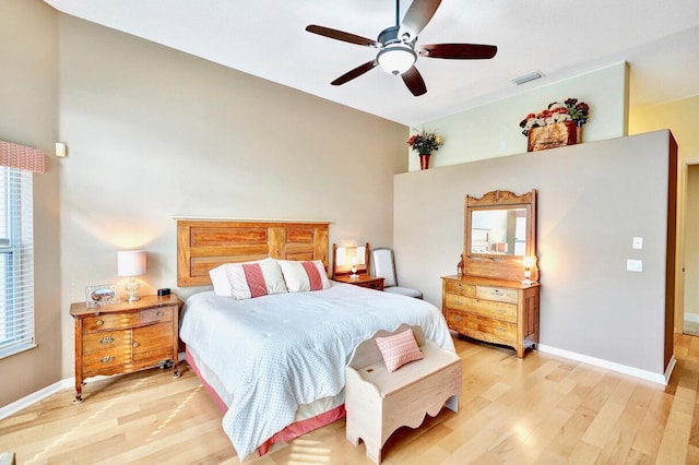 bedroom with ceiling fan and light hardwood / wood-style floors