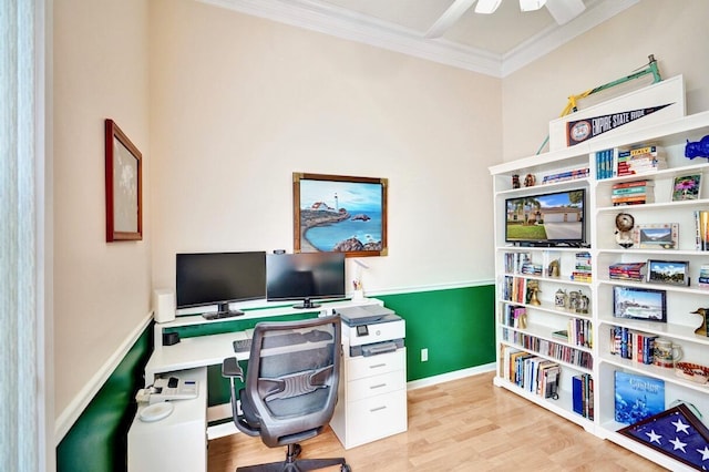 office space with crown molding, ceiling fan, and light hardwood / wood-style floors