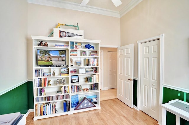 rec room featuring ornamental molding and hardwood / wood-style floors