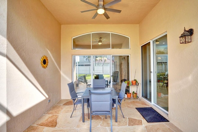 exterior space featuring ceiling fan