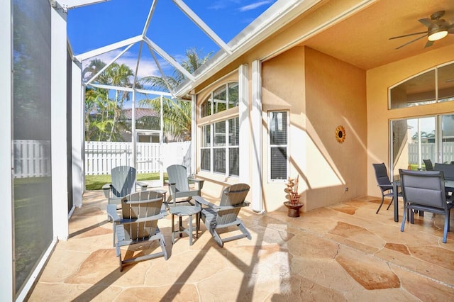 exterior space with a lanai and ceiling fan