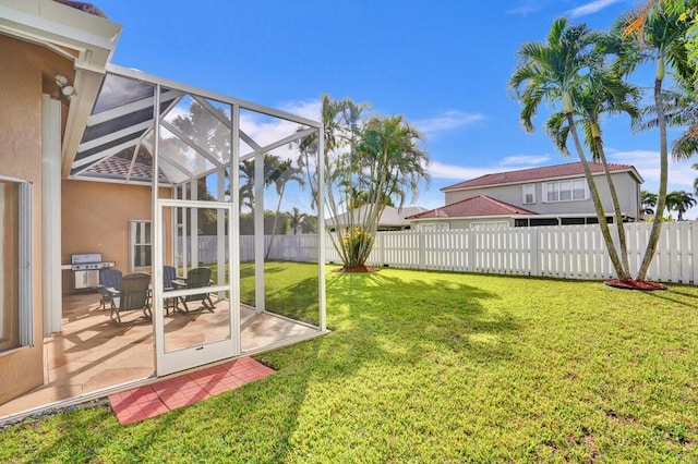 view of yard with glass enclosure