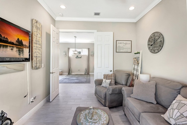 living room featuring crown molding and light wood-type flooring