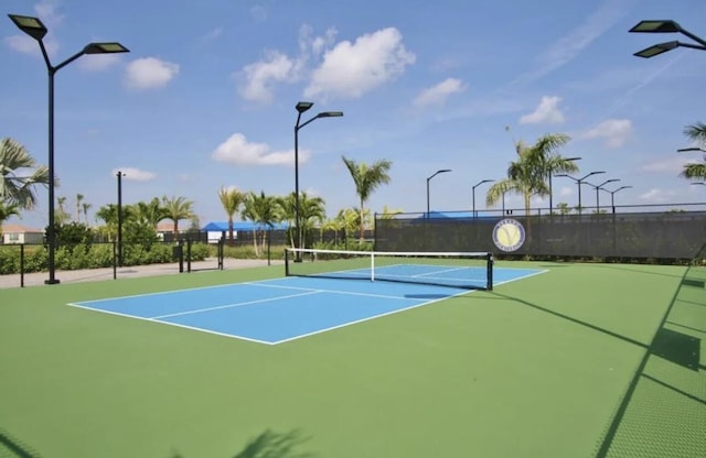 view of tennis court featuring basketball court