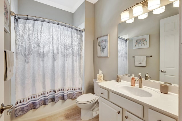 full bathroom with shower / tub combo with curtain, vanity, and toilet