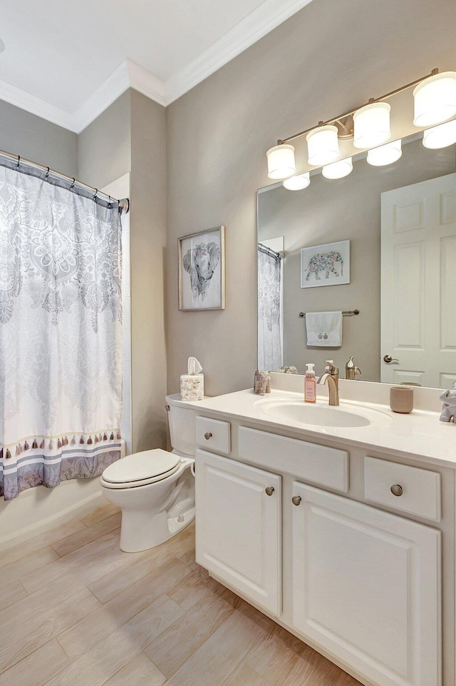 full bathroom featuring toilet, crown molding, shower / tub combo, vanity, and hardwood / wood-style flooring