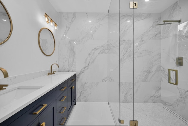 bathroom with vanity and a shower with shower door