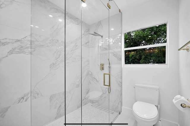 bathroom with an enclosed shower and toilet