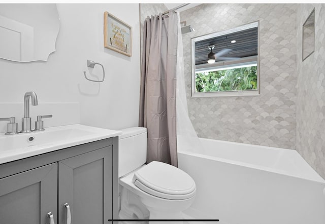 full bathroom with shower / bath combination with curtain, vanity, and toilet