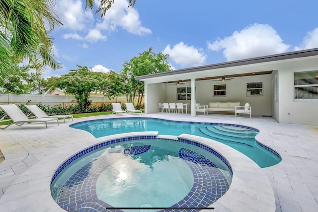 view of swimming pool with ceiling fan, an outdoor hangout area, and a patio