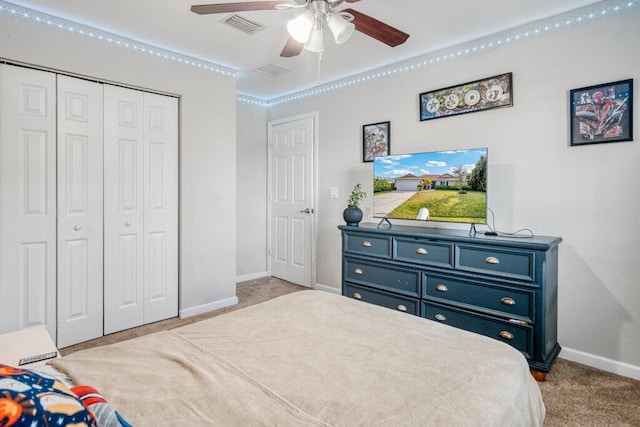 bedroom with light colored carpet, a closet, and ceiling fan