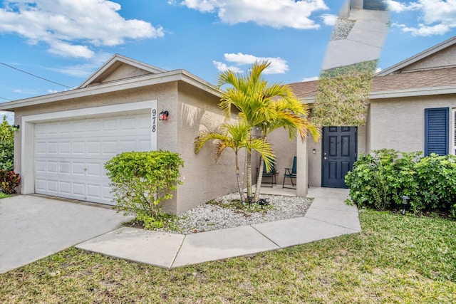 view of front of home featuring a garage and a front yard