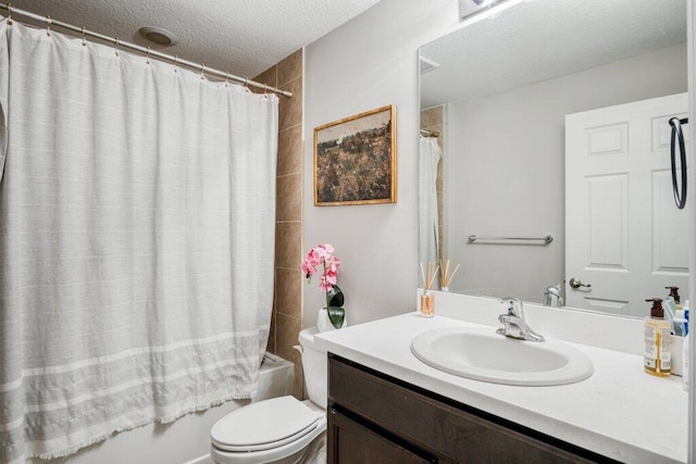 full bathroom with vanity, toilet, a textured ceiling, and shower / bath combo