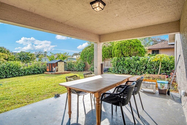 view of patio with a shed