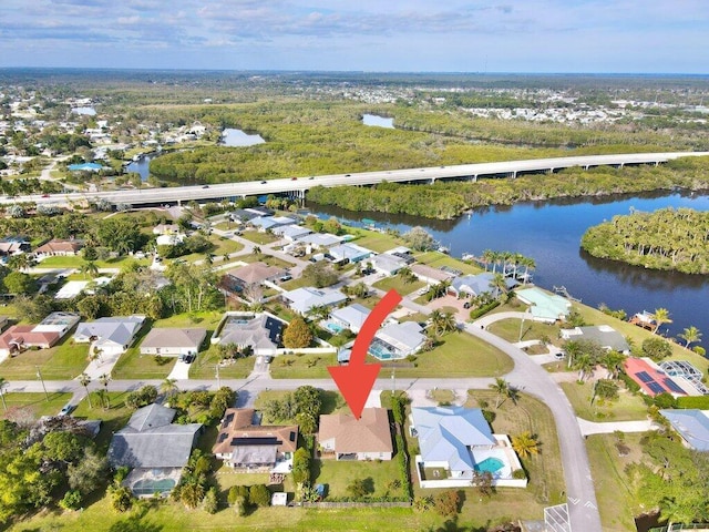 birds eye view of property featuring a water view