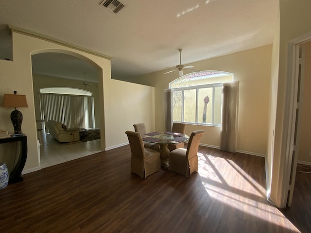 dining room featuring ceiling fan and dark hardwood / wood-style flooring