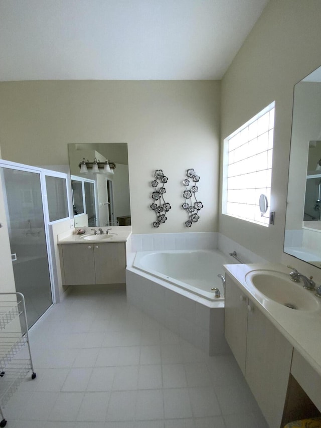 bathroom with vanity and plus walk in shower