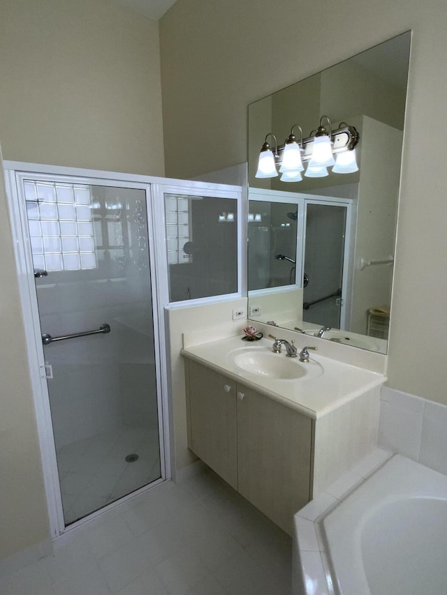 bathroom featuring vanity and separate shower and tub