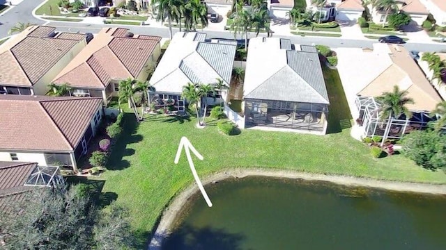 aerial view featuring a water view and a residential view