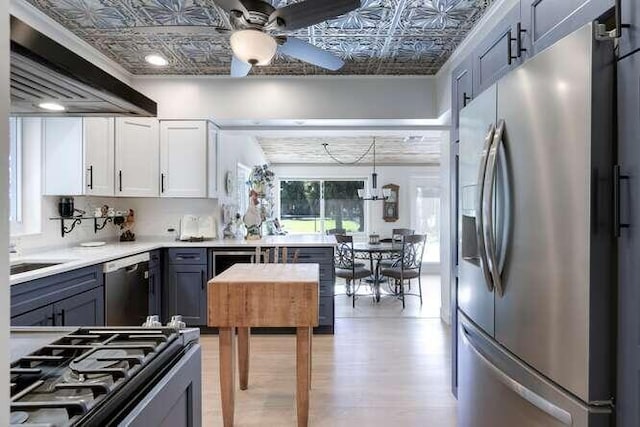 kitchen featuring gray cabinets, pendant lighting, white cabinetry, ceiling fan, and stainless steel appliances