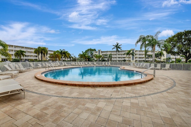 view of swimming pool with a patio area