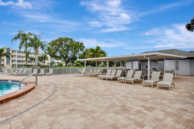 view of swimming pool with a patio area