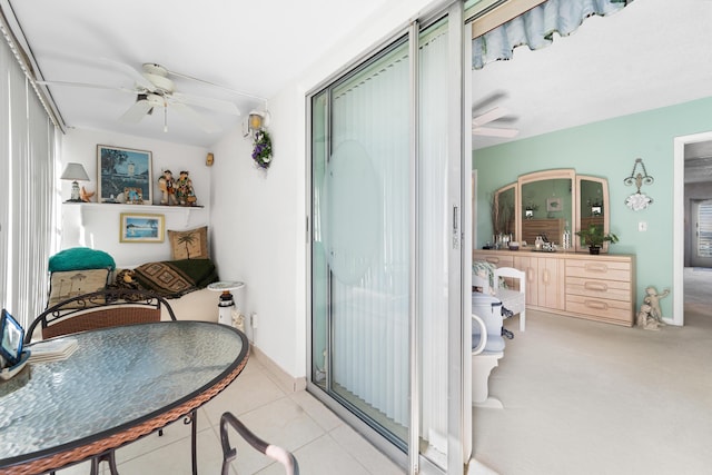 interior space featuring ceiling fan