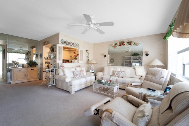 carpeted living room with ceiling fan