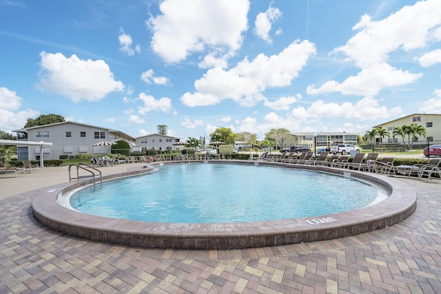 view of swimming pool with a patio area