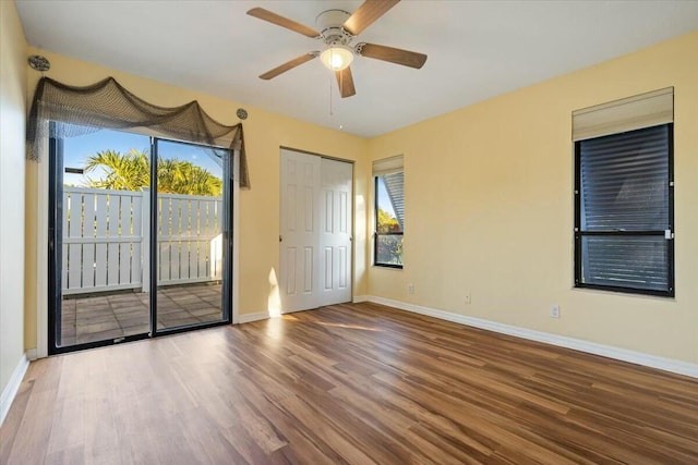 unfurnished room featuring hardwood / wood-style flooring and ceiling fan