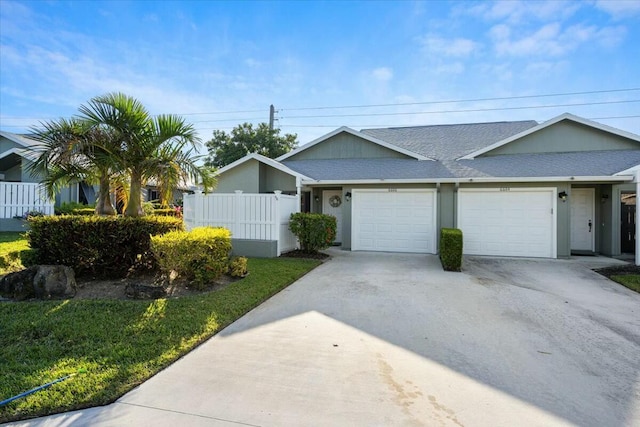 ranch-style home featuring a garage