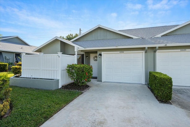 ranch-style house featuring a garage and a front yard