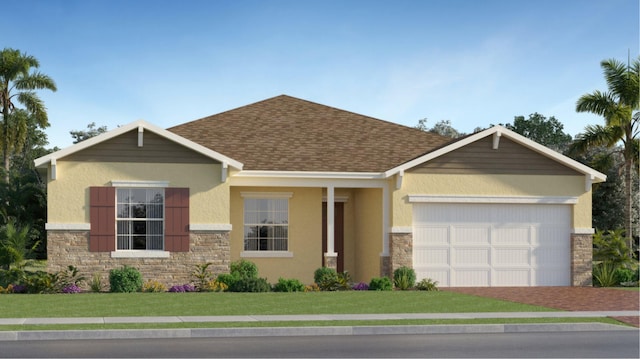 craftsman inspired home featuring a garage and a front lawn