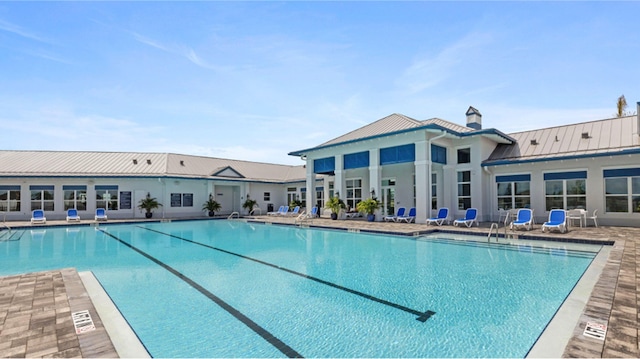 view of swimming pool featuring a patio area