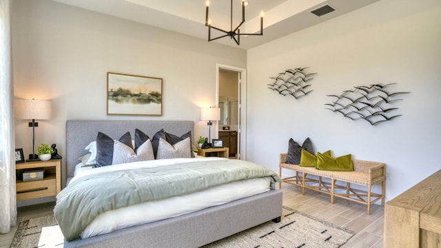 bedroom with a notable chandelier