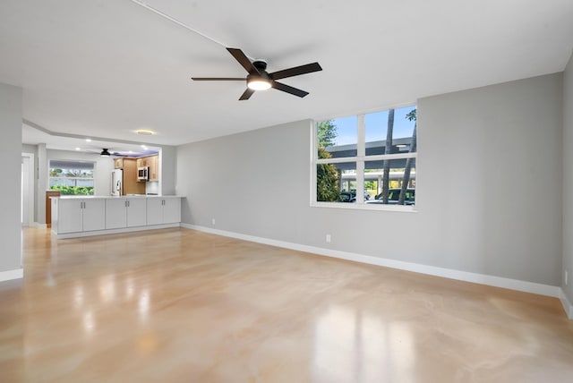 unfurnished living room featuring ceiling fan