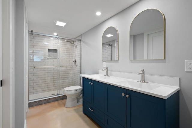 bathroom featuring vanity, an enclosed shower, and toilet