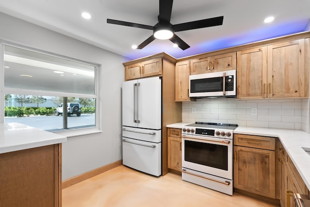 kitchen featuring tasteful backsplash, ceiling fan, and white appliances