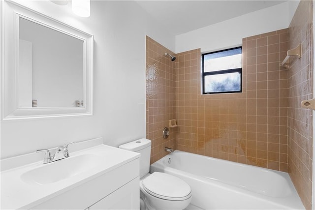 full bathroom with vanity, toilet, and tiled shower / bath combo