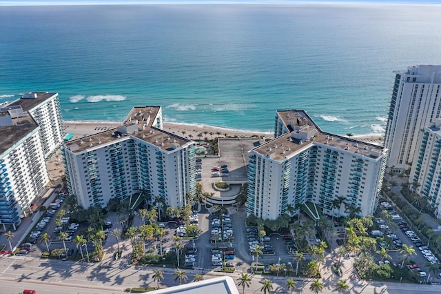 bird's eye view with a water view and a view of the beach