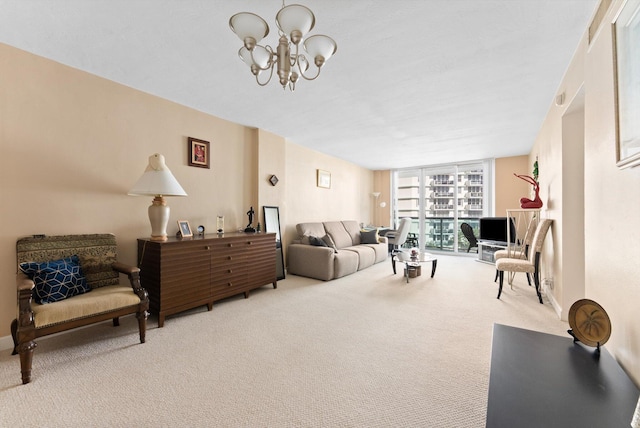 carpeted living room featuring an inviting chandelier and a wall of windows