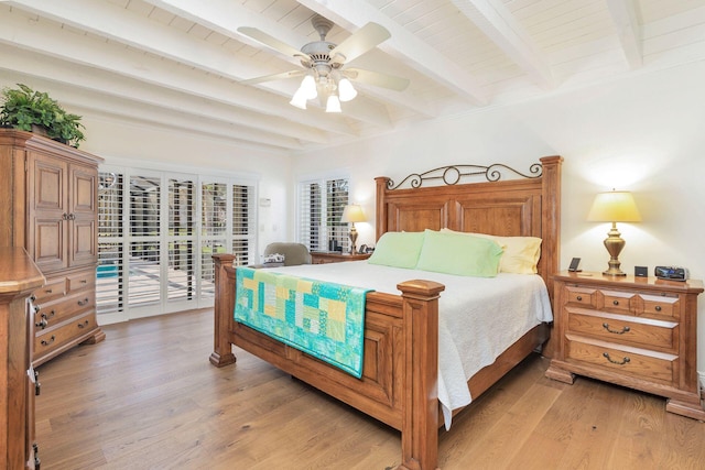 bedroom featuring beamed ceiling, ceiling fan, access to exterior, and light hardwood / wood-style flooring